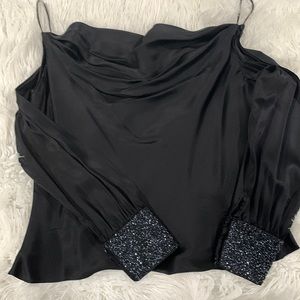 Black silky blouse with cut out sleeves and sequins cuffs